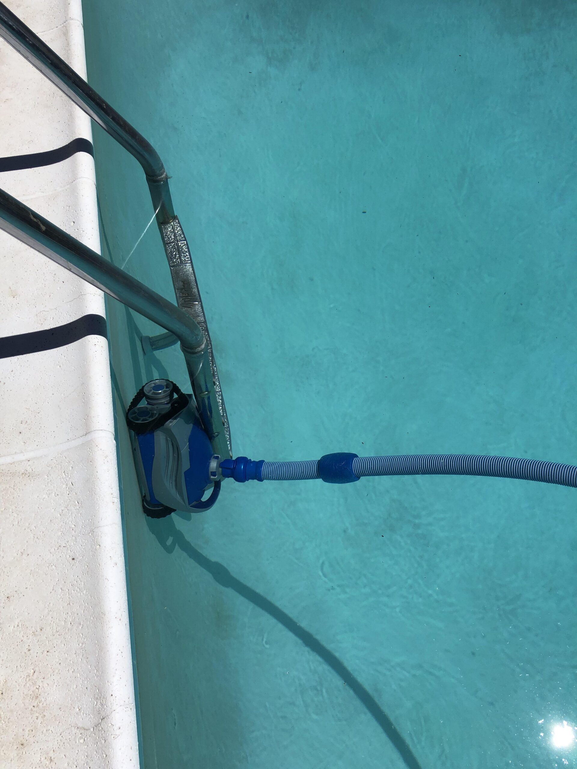 How to Keep Pool Vacuum from Getting Stuck on Ladder